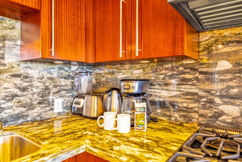 Granite counters and coffee essentials for a smooth start to your mornings.