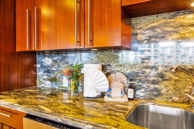 Bright, efficient layout with stylish backsplash and under-cabinet lighting.