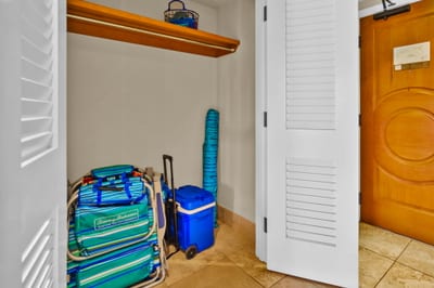 Complimentary beach gear, snorkels, and pool toys organized in this tucked-away storage nook near the entry.