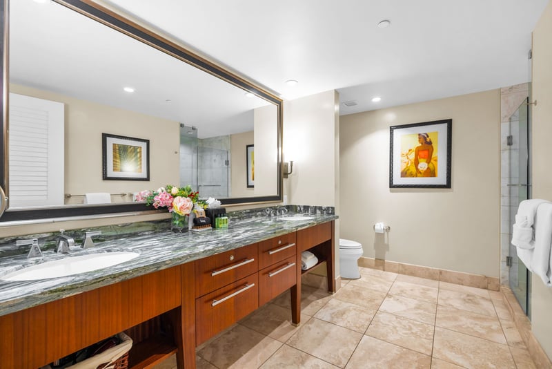 Refresh in your ensuite with a spacious layout, oversized mirror, and elegant tilework throughout.