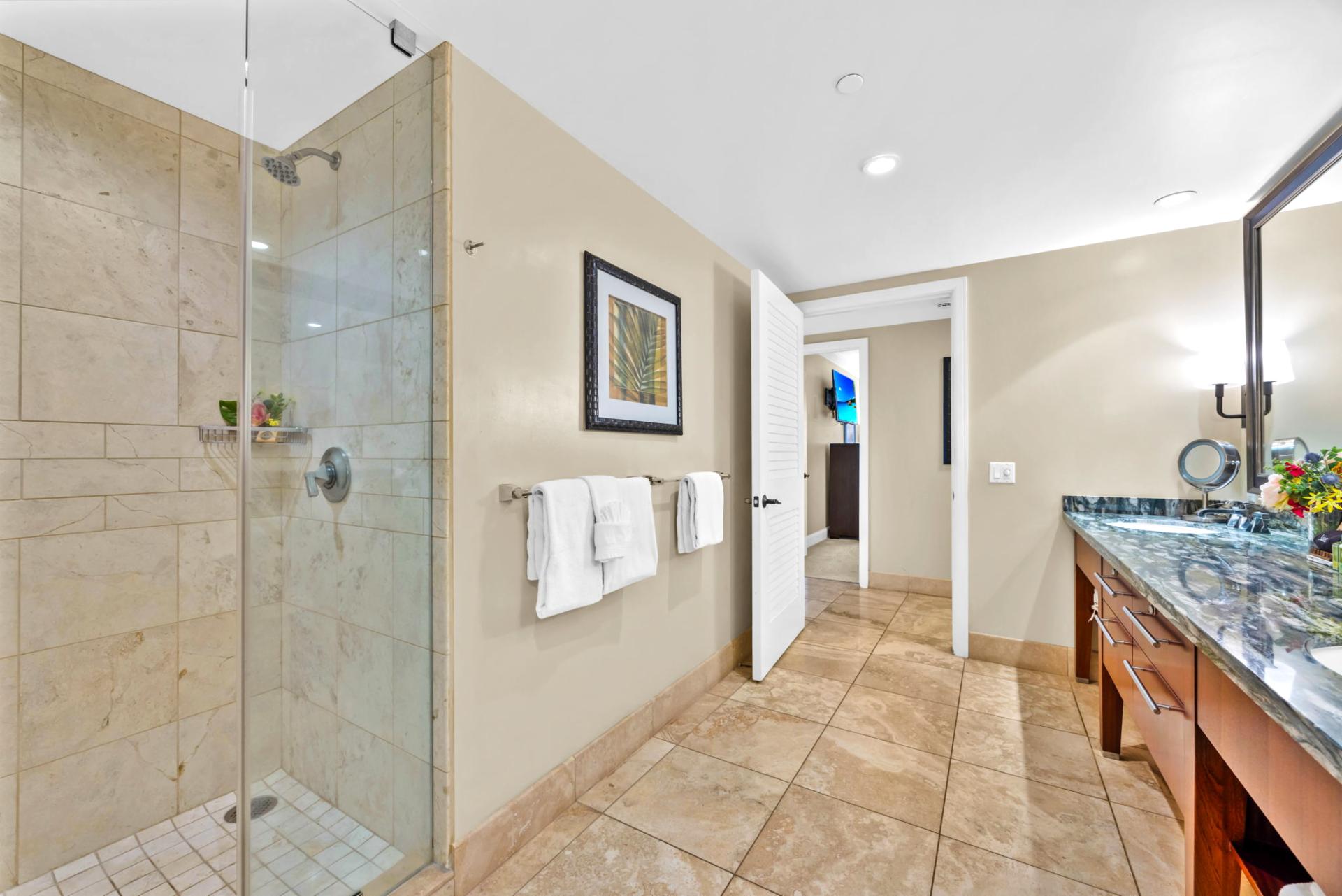 Step into your glass walk-in shower or soak in the deep tub after a full day of island adventure. HKH-203
