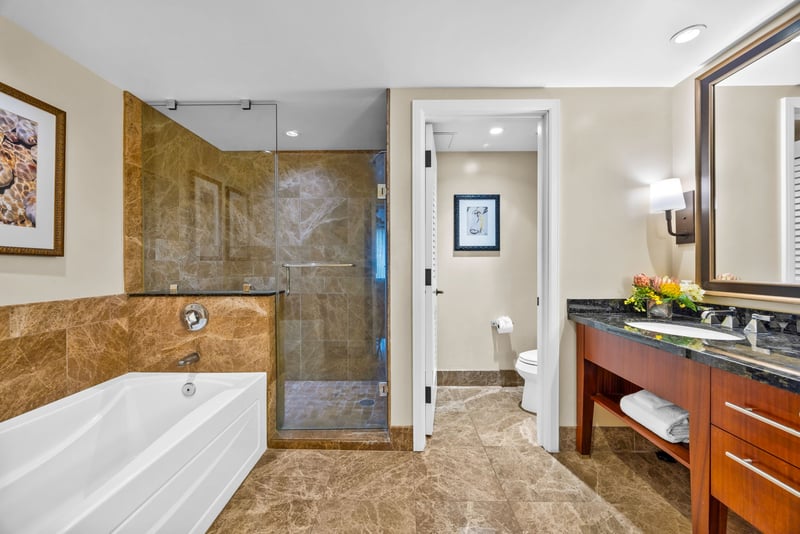Granite counters and tile finishes make your guest bath feel just as refined as the primary.