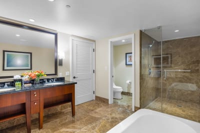 Your second guest bath offers a granite vanity and full amenities just steps from the bedroom.