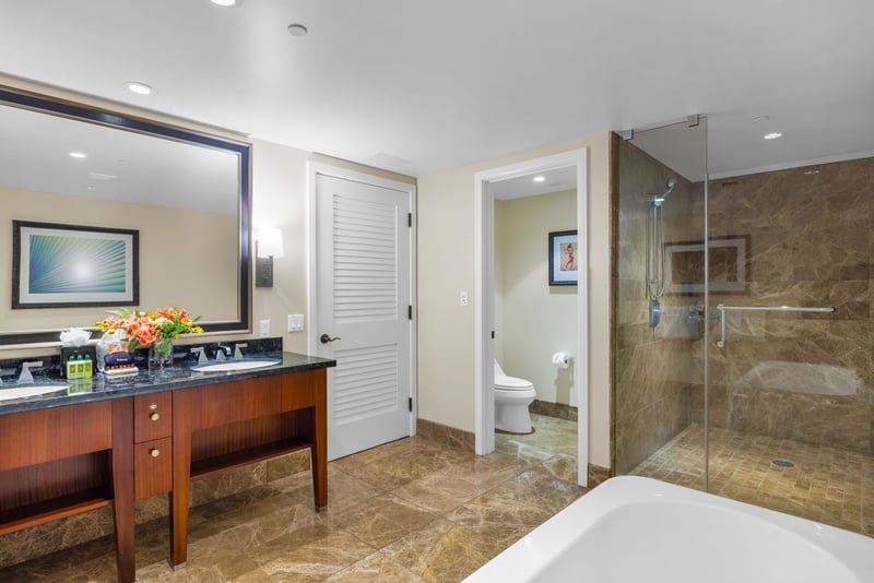 Your second guest bath offers a granite vanity and full amenities just steps from the bedroom.