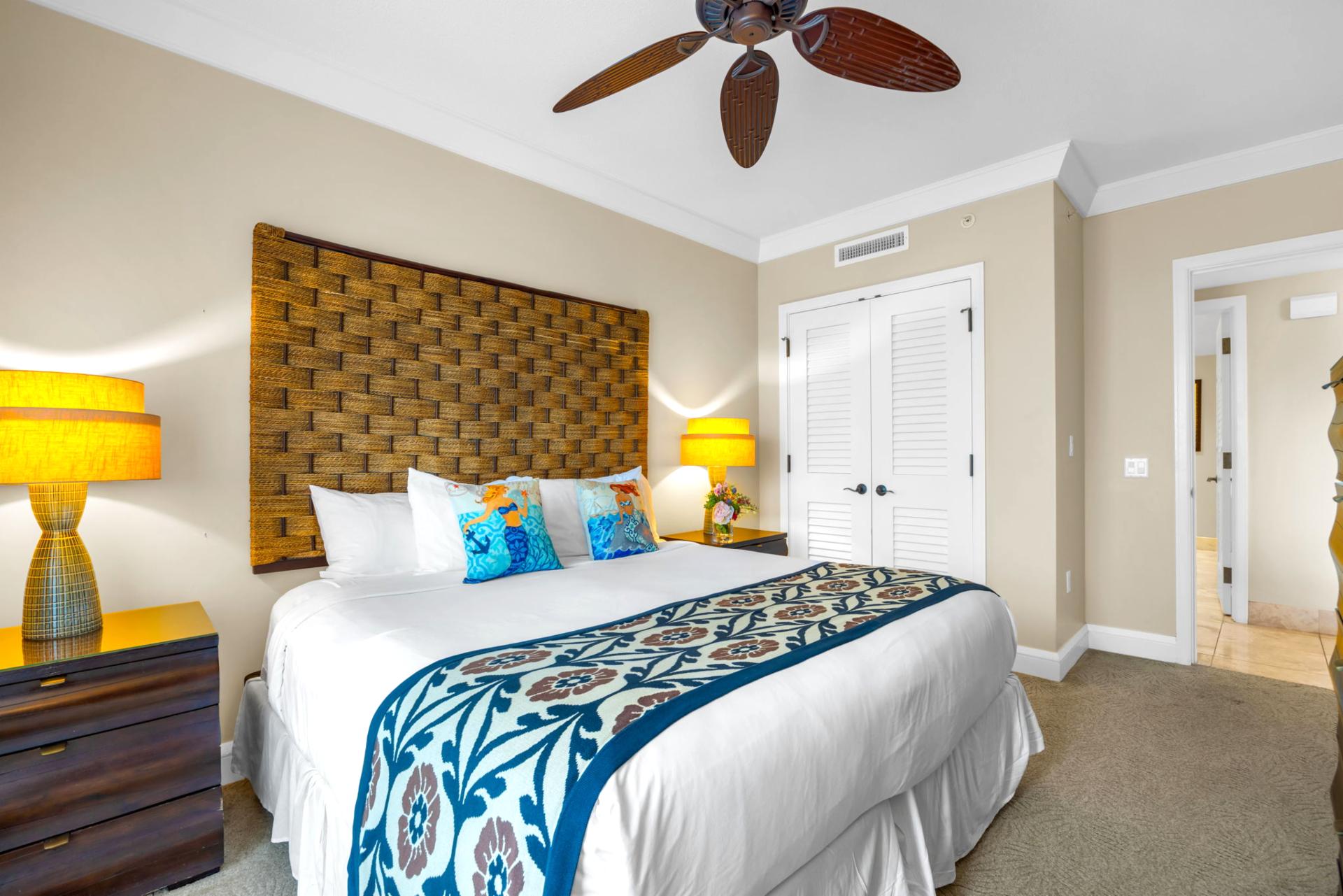 King bed and soft lighting set a peaceful tone in the primary bedroom with ensuite bath. HKH-203