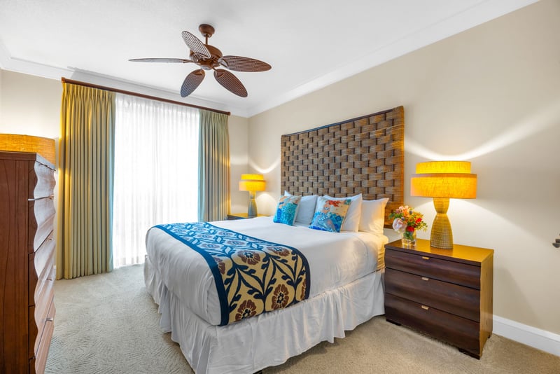 Primary bedroom with a King bed, textured headboard, and calming tones for a luxurious retreat.
