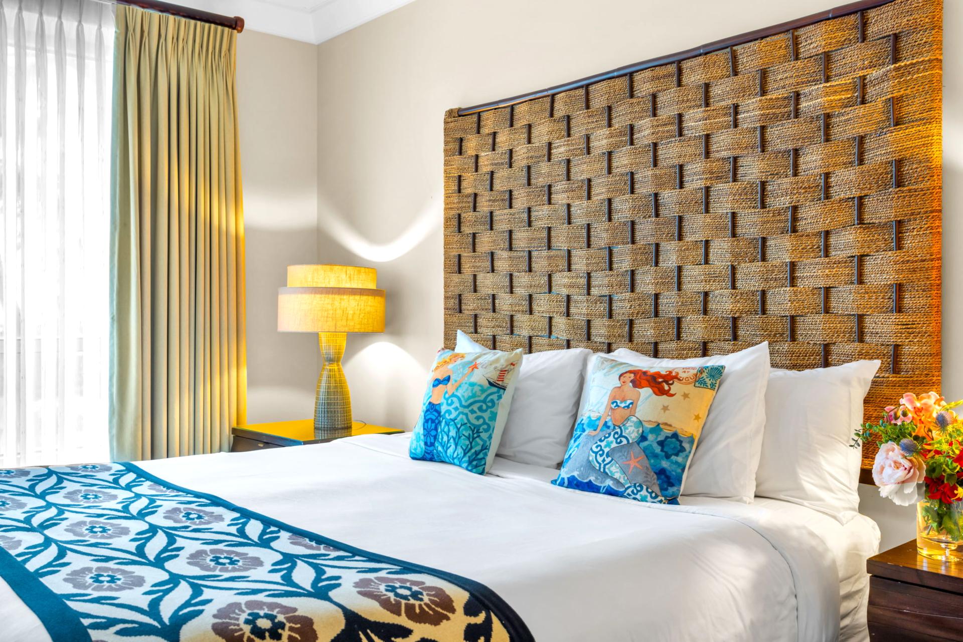 Spacious master suite with King bed and ceiling fan, designed for restful nights and quiet mornings. HKH-203