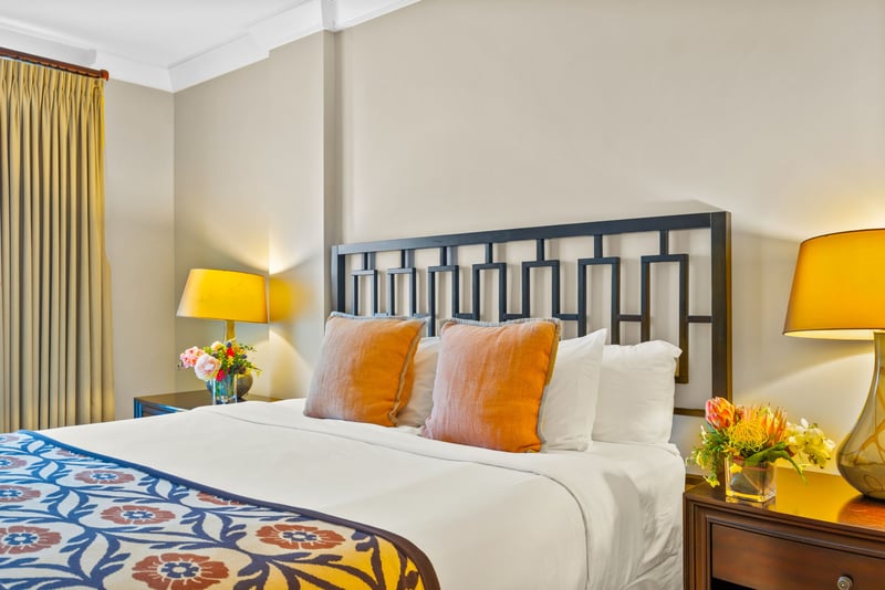 This guest room offers a bright and inviting space with cheerful decor and a Queen bed for restful sleep.