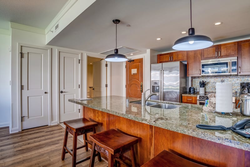 Cook, dine, and unwind in this open-concept oasis with tropical views HKH-211
