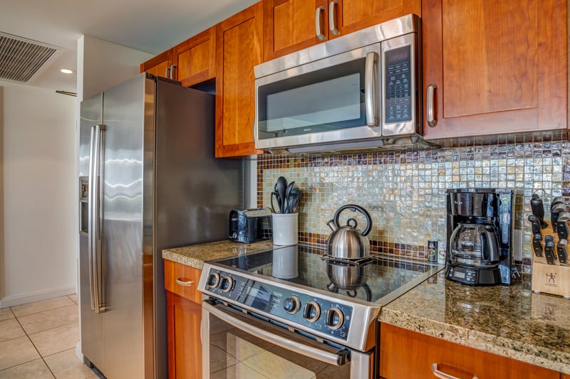 Fully equipped gourmet kitchen with sleek stainless-steel appliances HKH-211
