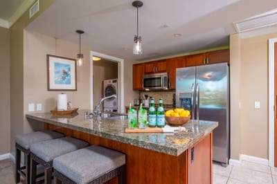 Modern kitchen with granite counters, stainless appliances, and everything needed for home-cooked meals.