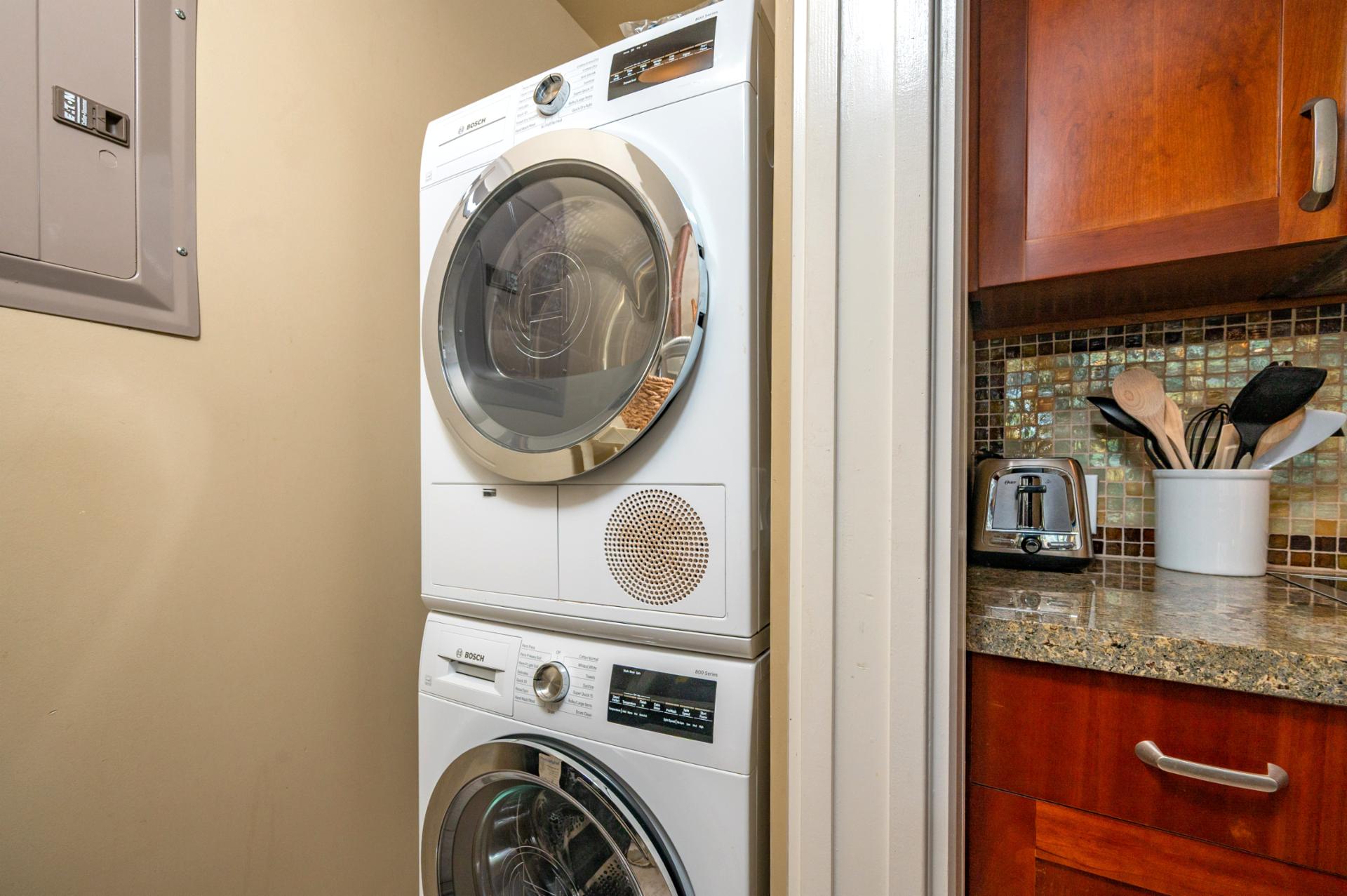 In-unit washer and dryer tucked conveniently for longer stays and easy refreshes.