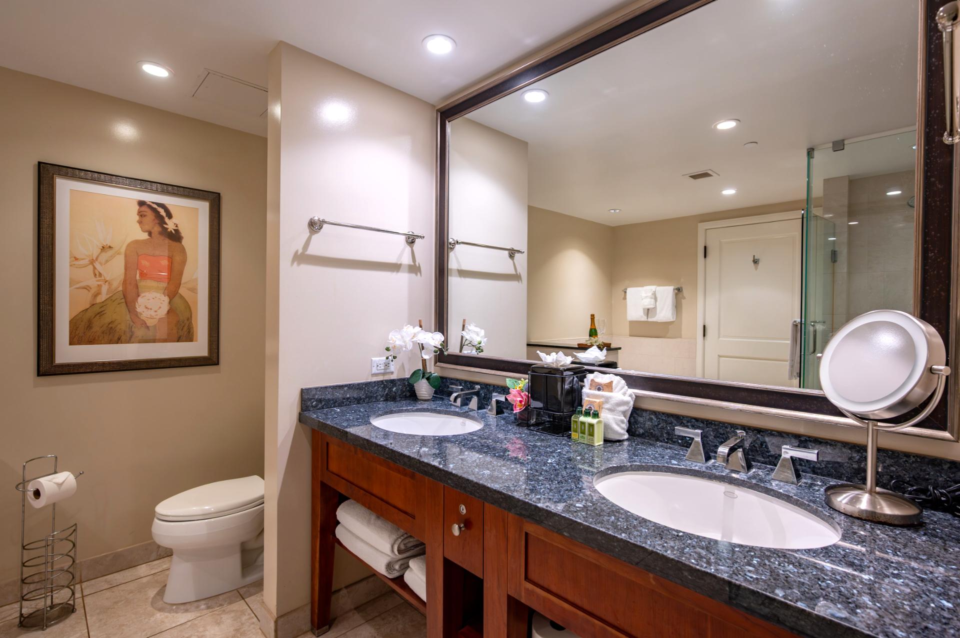 Dual-sink granite vanity and generous counter space in the primary bath make mornings easy.