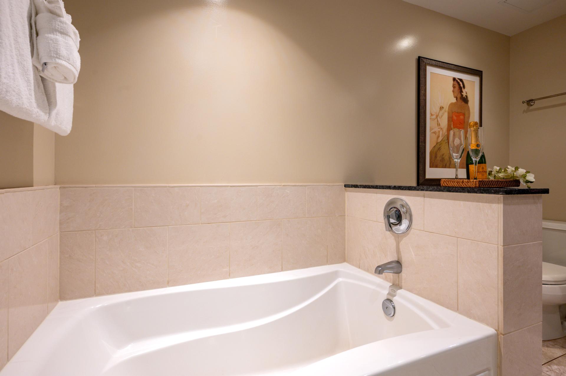 Deep soaking tub invites you to unwind in comfort after a day of exploring.