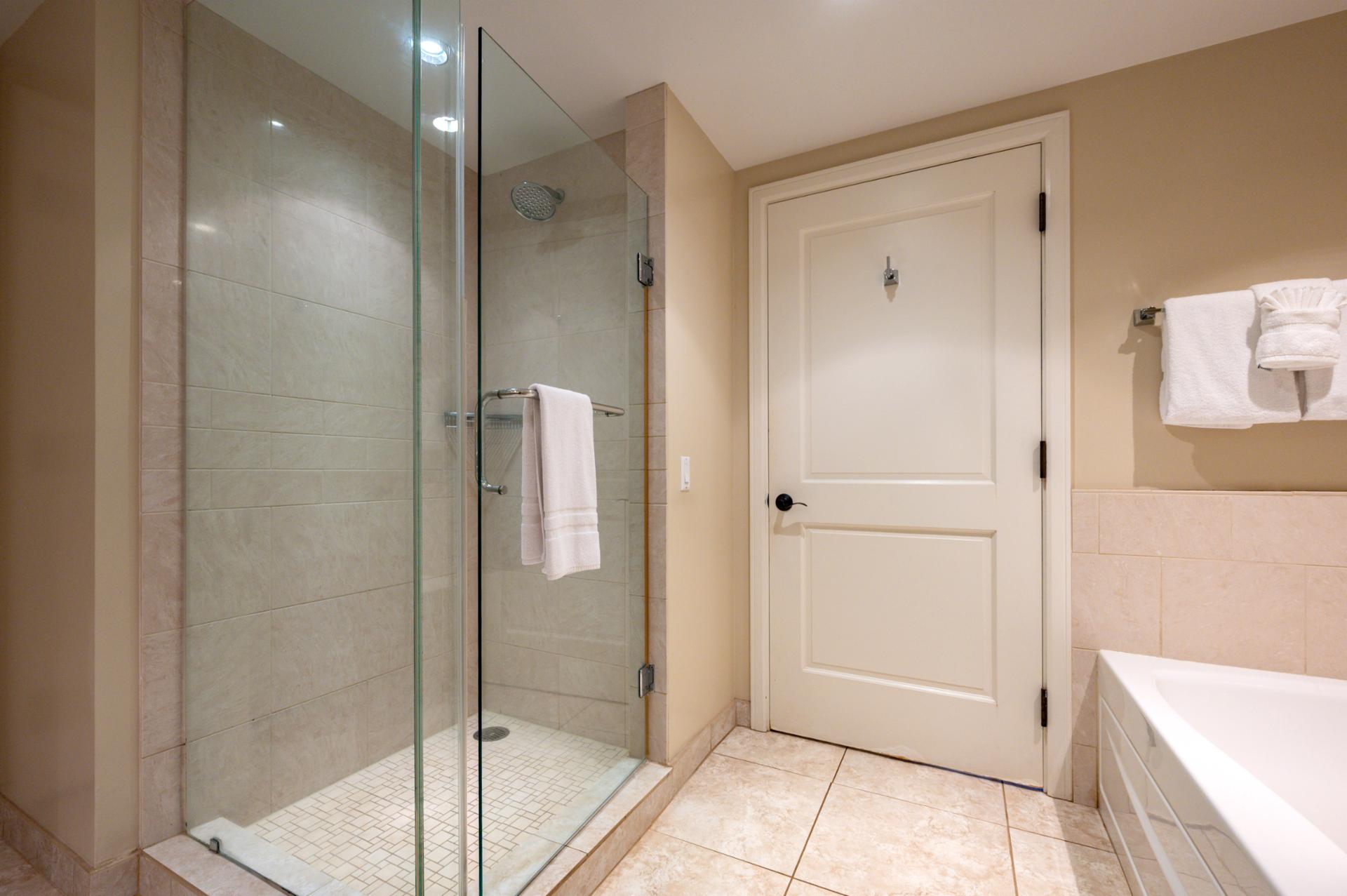 Walk-in glass shower and spacious layout in the primary bathroom for a spa-style refresh.