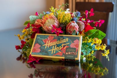 Tropical florals add a cheerful welcome to your dining space, set beside the fully equipped kitchen.