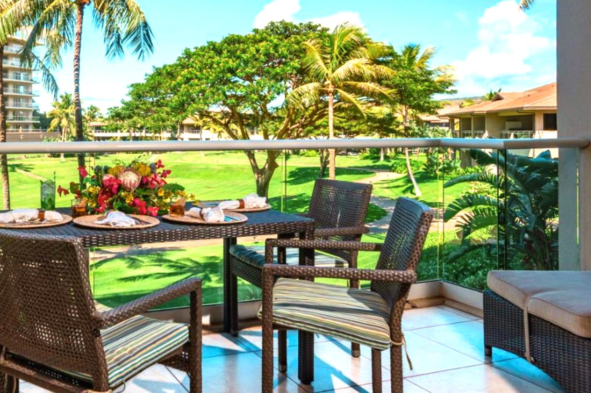 Private lanai with lush garden views and a dining table perfect for morning coffee or open-air meals.