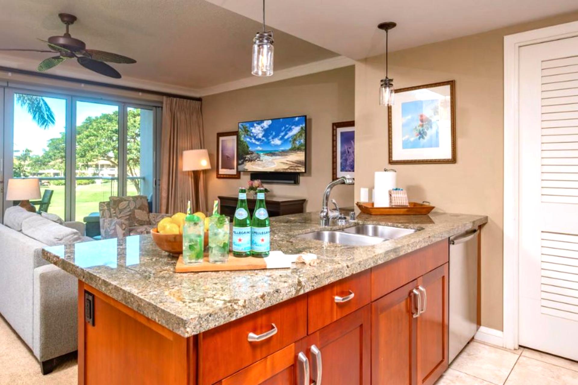 Large island with bar seating connects kitchen and living, great for casual breakfasts or social cooking.