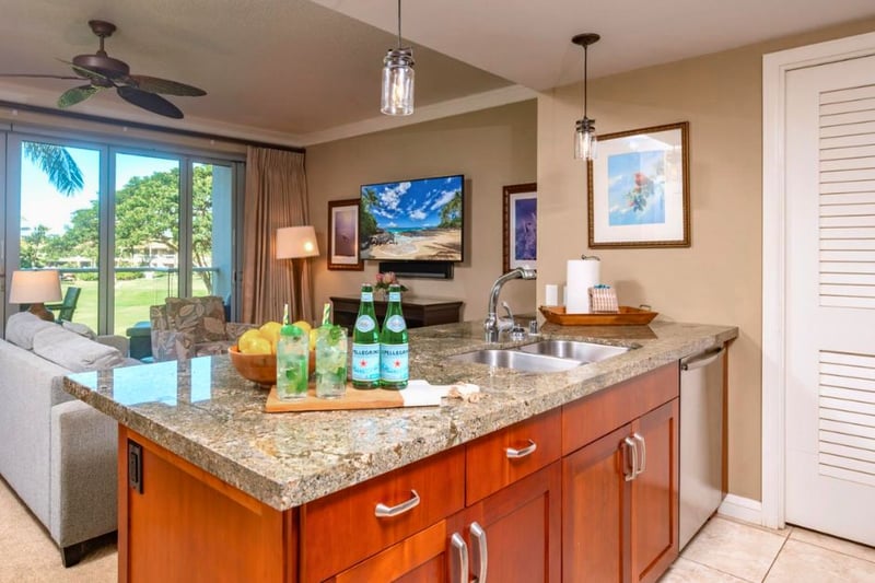 Large island with bar seating connects kitchen and living, great for casual breakfasts or social cooking.