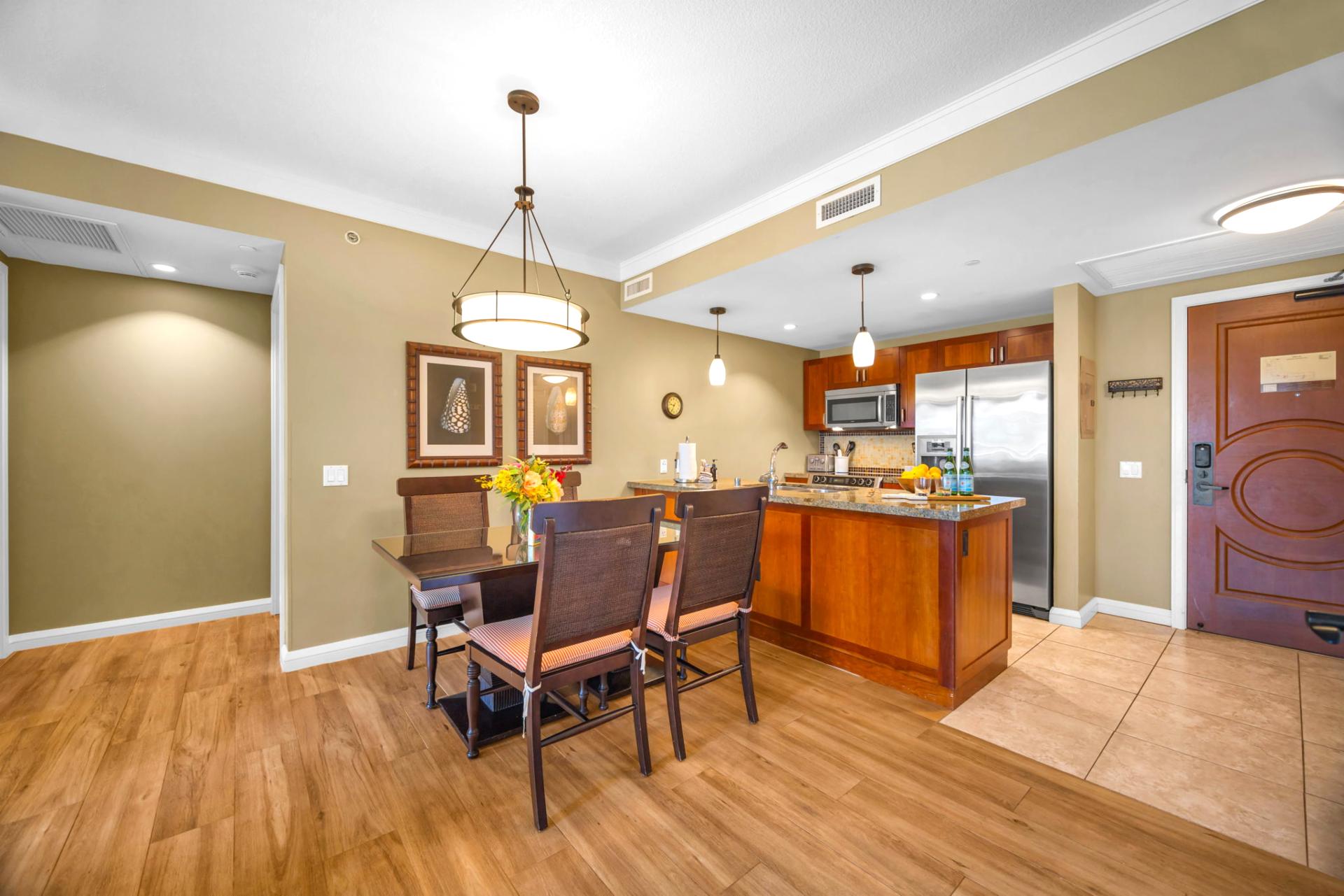 Dine indoors with views of the resort gardens through wide lanai doors that invite the breeze in.