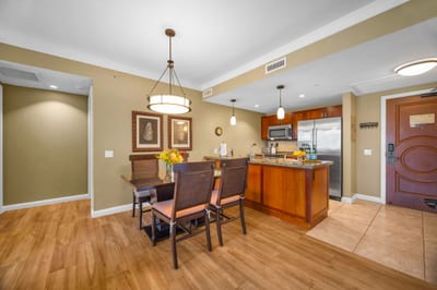 Dine indoors with views of the resort gardens through wide lanai doors that invite the breeze in.