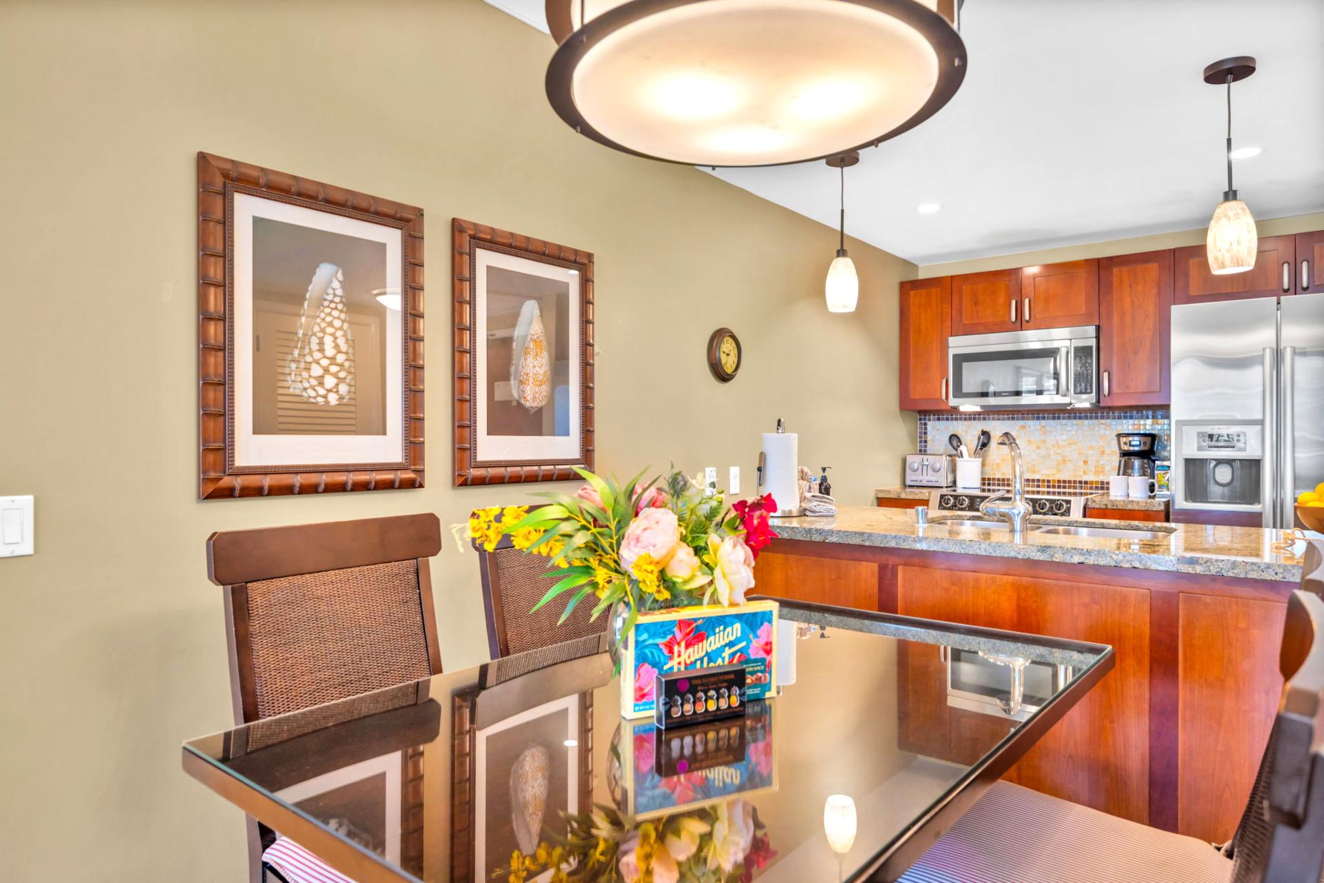 Cook with confidence in your fully equipped kitchen featuring stainless appliances, granite counters, and bar seating for two.
