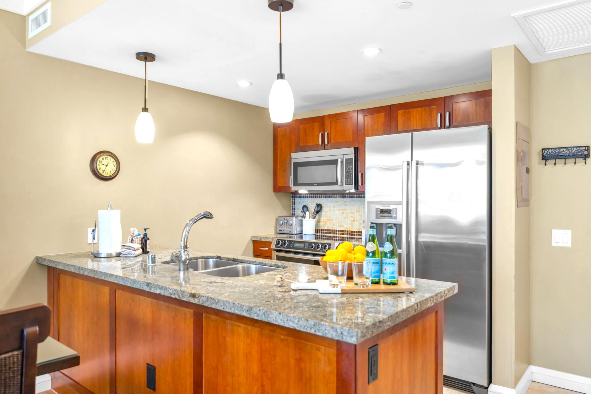 Granite counters, full-size appliances, and ample cabinet space make this kitchen ready for everything from snacks to full dinners.