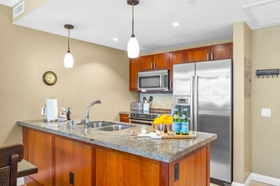 Granite counters, full-size appliances, and ample cabinet space make this kitchen ready for everything from snacks to full dinners.