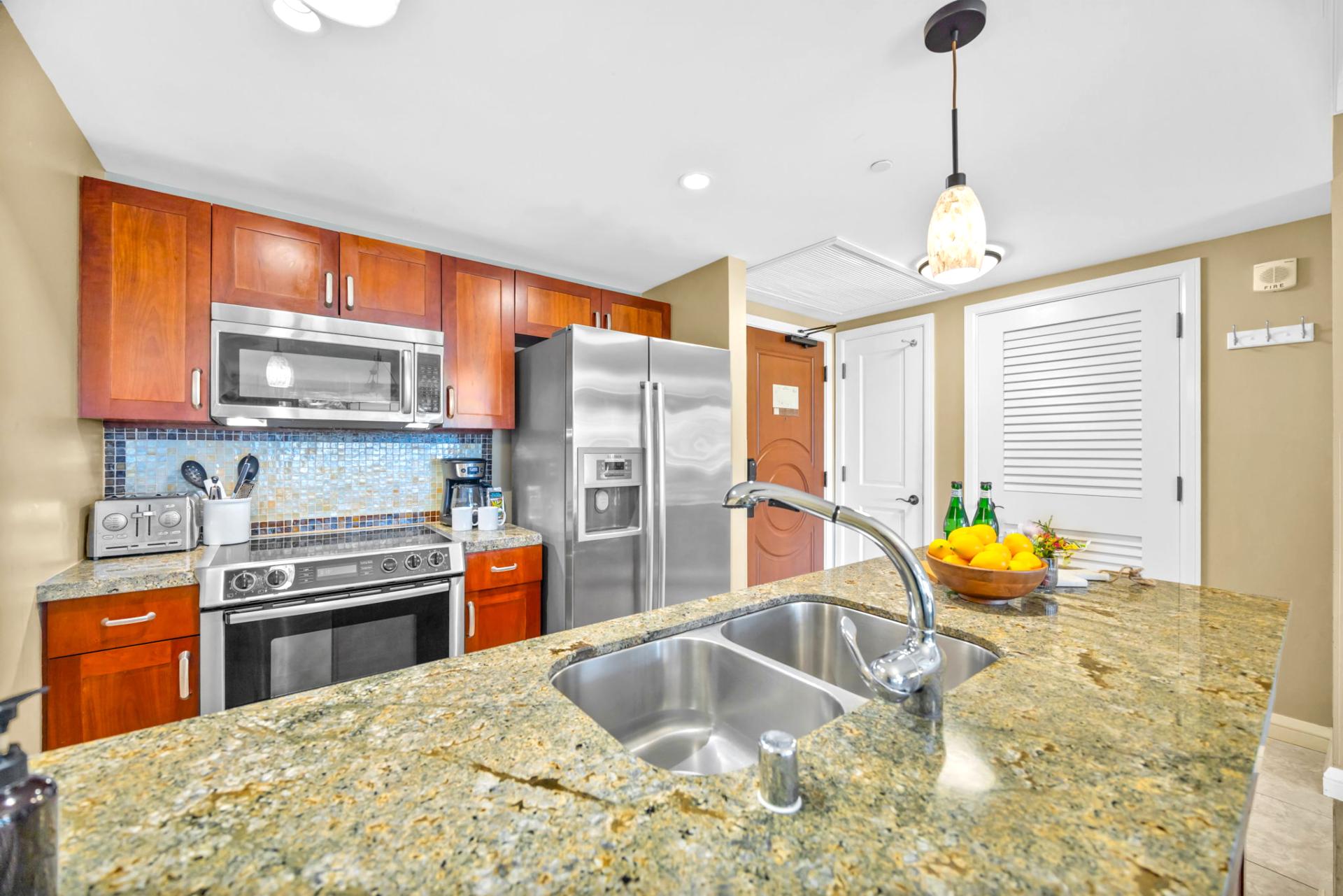 Blend island flavors in your well-stocked kitchen with stainless appliances and convenient breakfast bar seating.
