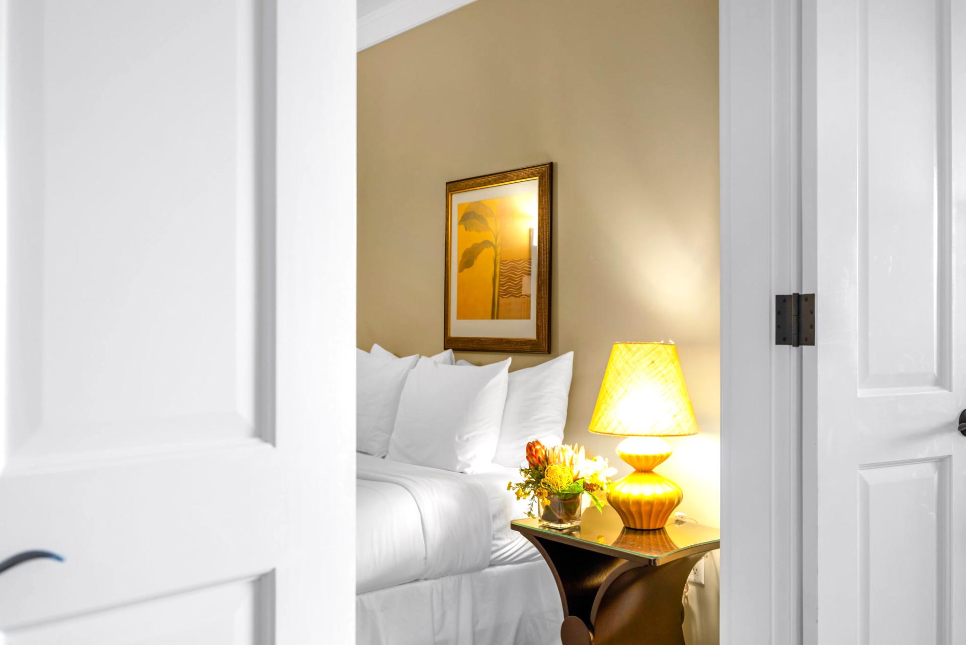 Enjoy privacy and comfort in the guest room, perfect for kids or friends with its soft tones and Queen bed.