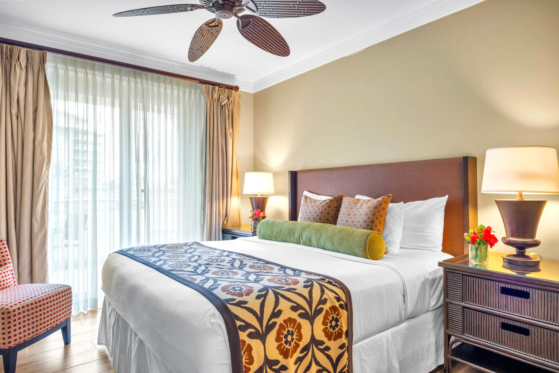 Retreat to your primary bedroom with King bed, Smart TV, and tropical views for a restful night’s sleep.