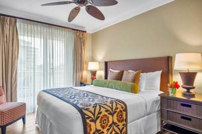 Retreat to your primary bedroom with King bed, Smart TV, and tropical views for a restful night’s sleep.
