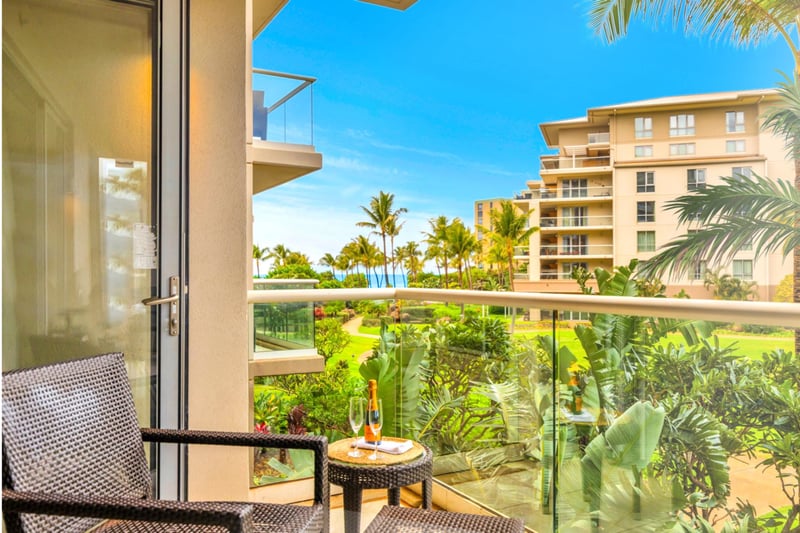 Slide open the glass doors to connect your living space to the generous lanai, offering indoor-outdoor flow and natural light.