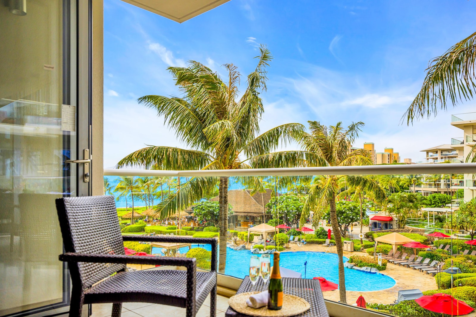 Tropical resort and ocean views from this private balcony make every morning coffee unforgettable. HKH-305