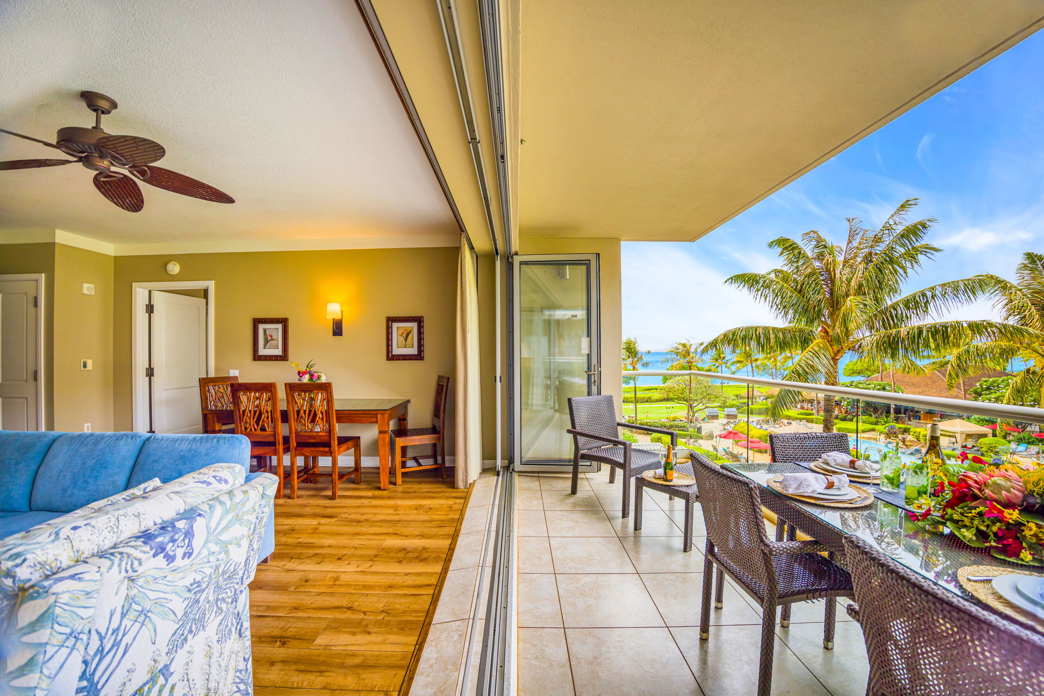 Covered balcony with ceiling fan and seating for six for your shaded afternoons or sunset dinners. HKH-305