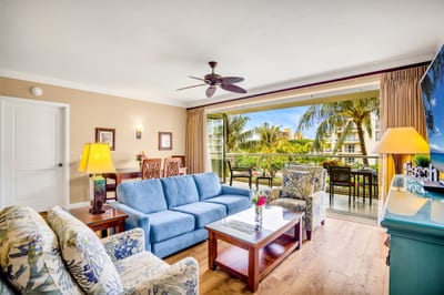 Open living area with plush seating, balcony access, and natural light for easy indoor-outdoor flow. HKH-305