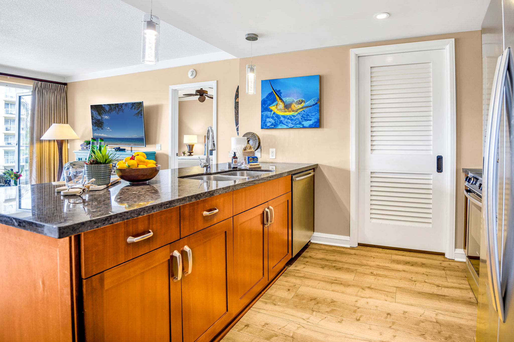 Extended counter space and updated appliances in this open-concept kitchen, ideal for group cooking. HKH-305