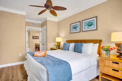 Spacious King bedroom with coastal accents and a ceiling fan for restful nights. HKH-305