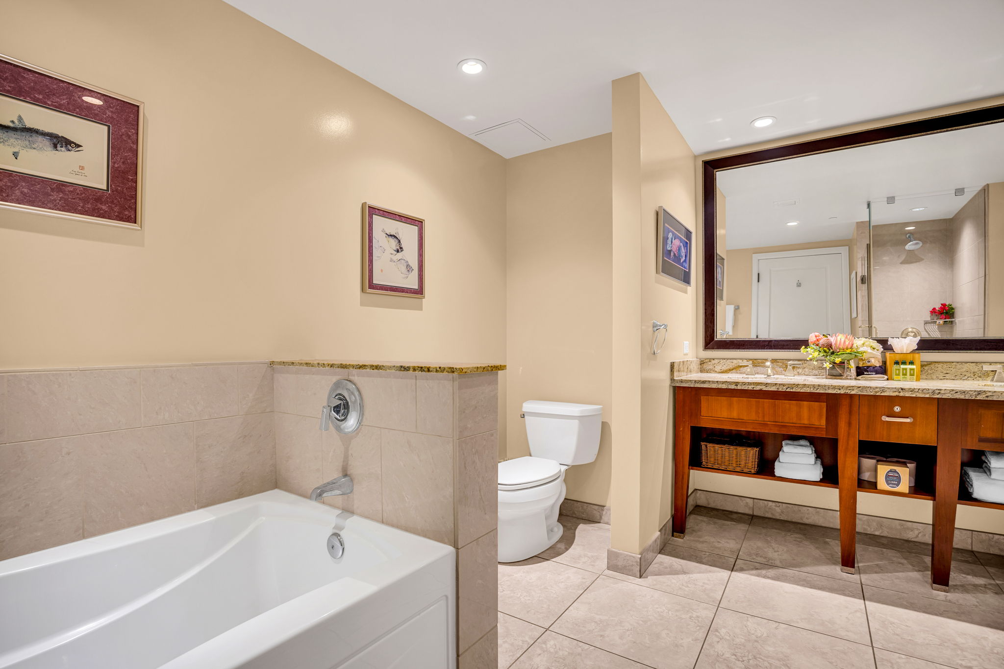 Soaking tub and separate walk-in shower in a bathroom designed for laid-back luxury. HKH-305
