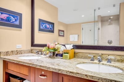 Double vanity with granite counters and plenty of space to unpack in the spa-style ensuite. HKH-305