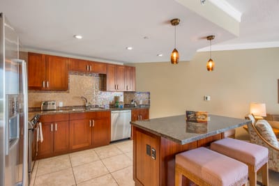 Gourmet kitchen with rich cabinetry, built-in appliances, and a granite island perfect for entertaining