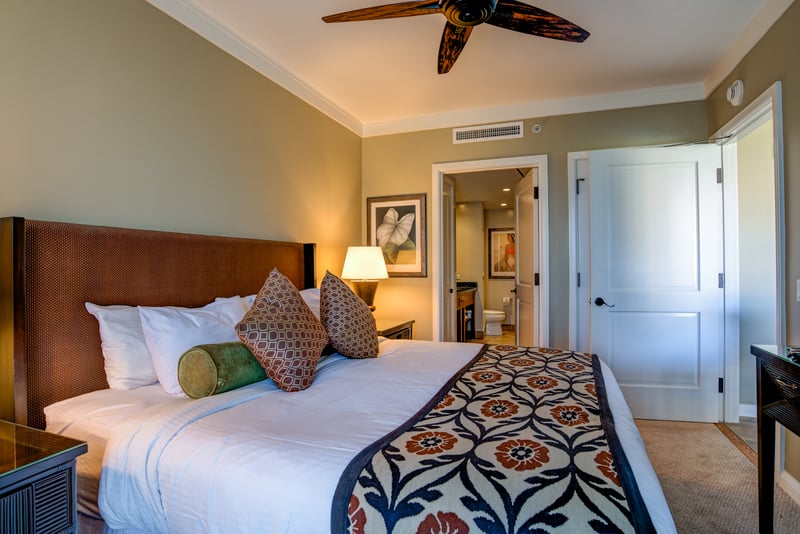 Large master suite complete with ceiling fans and large storage space   