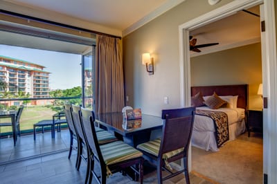 Enjoy meals with a breeze and retreat to comfort—balcony dining meets plush bedroom luxury in Maui’s best HKH-338