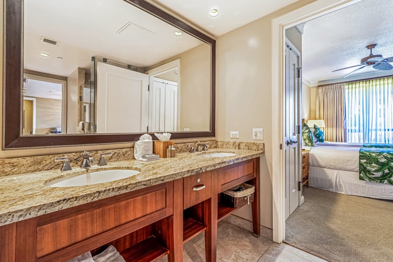 Double vanity, granite finishes, and plenty of room to pamper