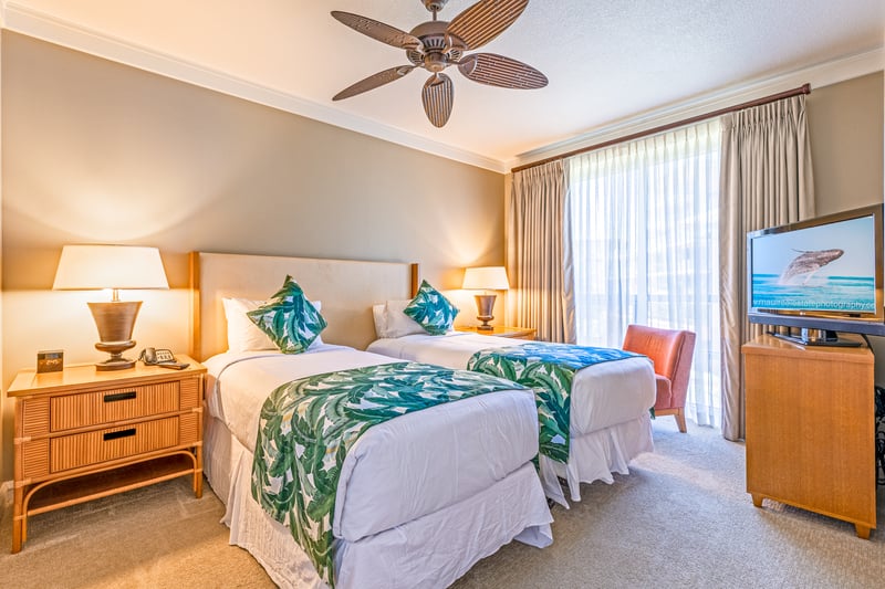 Comfortable twin beds and tropical charm make this the perfect guest retreat