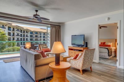 Relax in style—spacious suite with balcony and ocean breeze. HKH-412