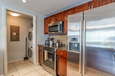 Fully equipped kitchen with stainless steel appliances and built-in convenience HKH-412