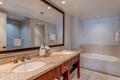 Elegant bathroom retreat with double sinks, soaking tub, and luxury finishes. HKH-412
