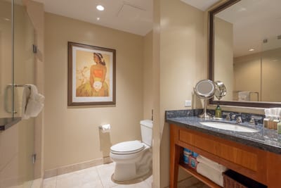 Elegant bathroom with granite countertops, double vanity, and spa-style lighting for a luxurious experience. HKH-423