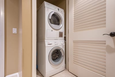 Laundry made simple with full-size washer/dryer combo tucked discreetly in your Maui suite HKH-423